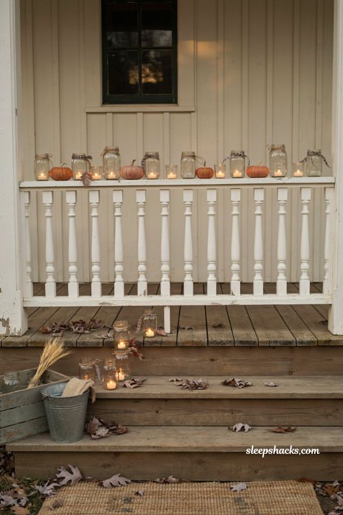 Vintage fall porch decor with mason jar candlelight and rustic accents
