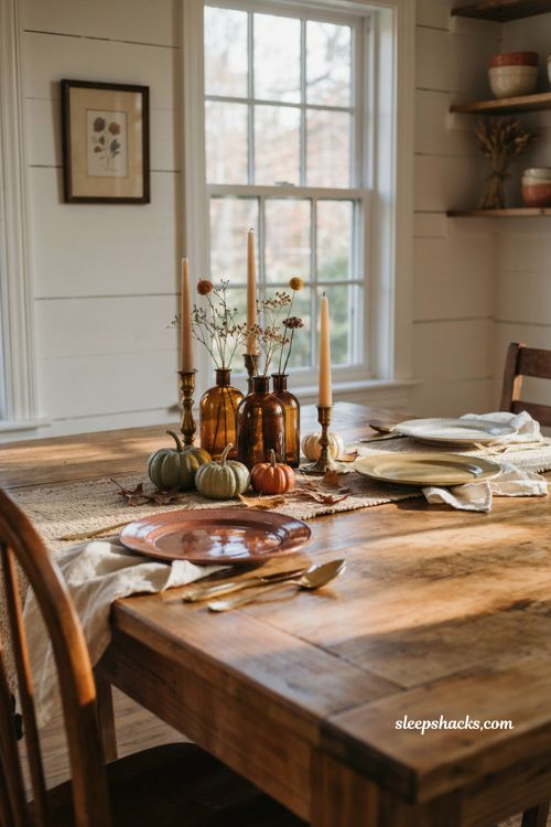 Vintage fall tablescapes with amber bottle bud vases and white linens