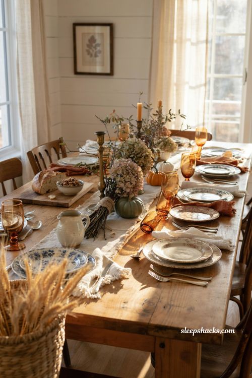 Vintage fall tablescapes with mismatched dishes and antique table decor