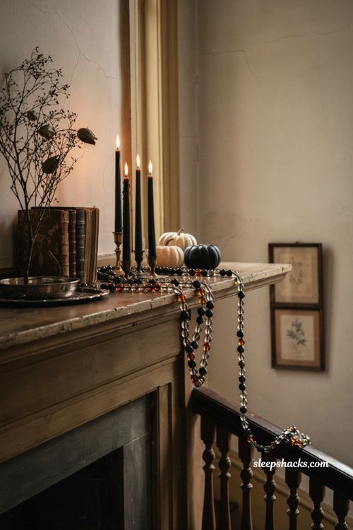 Vintage glass bead Halloween garland on an antique mantel with candlelight 