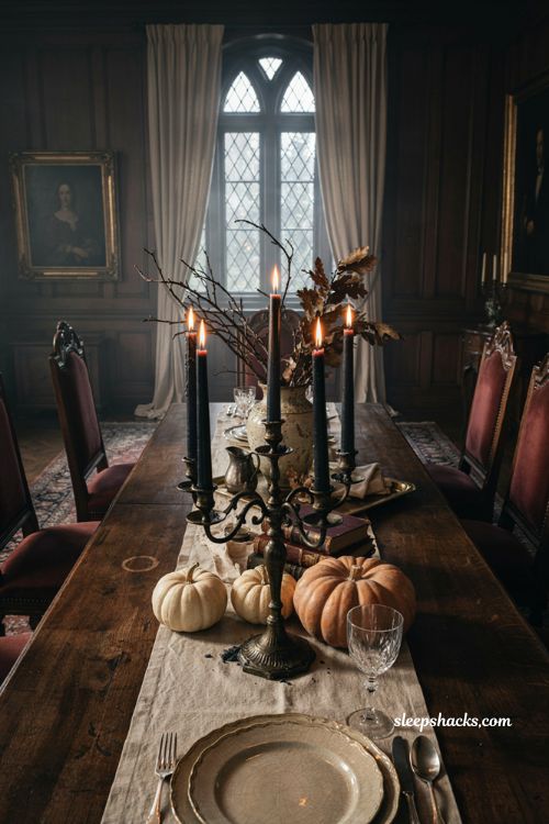 Vintage iron candelabra with black taper candles for elegant Halloween decor