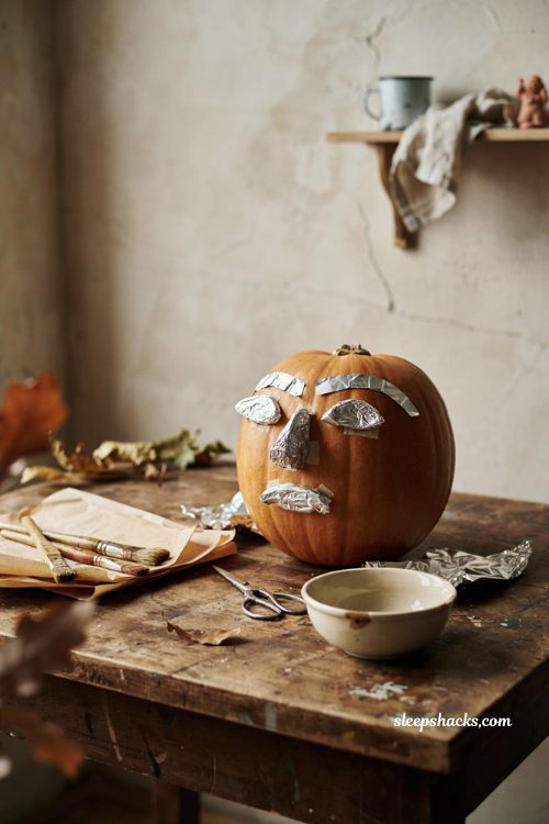 Vintage pumpkin face with foil sculpted paper mache details