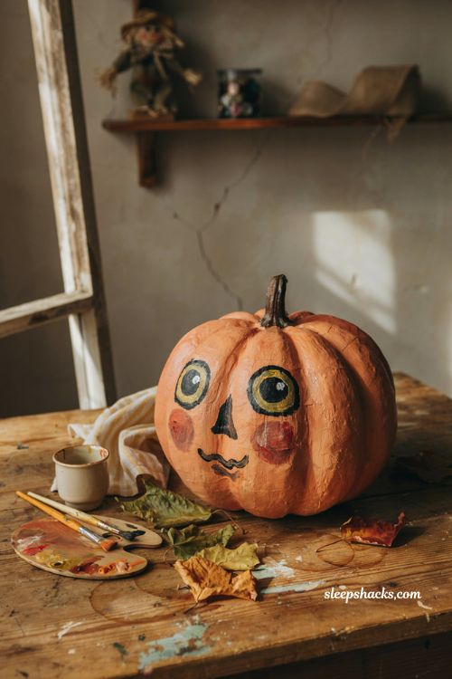 Vintage pumpkin face with rosy cheeks and glowing eyes