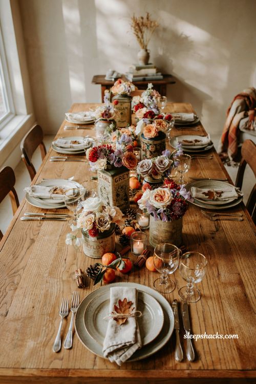 Vintage tea tin centerpieces for a nostalgic fall baby shower with roses gomphrena and sweet peas