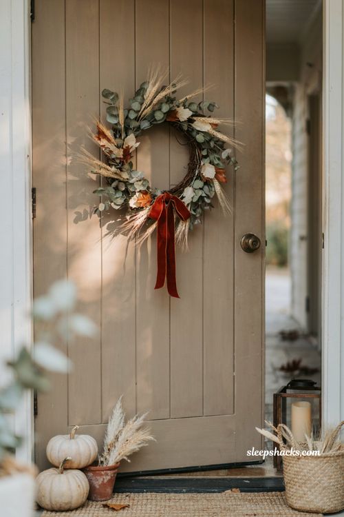 Warm fall wreath with eucalyptus wheat sage cream rust leaves and velvet ribbon