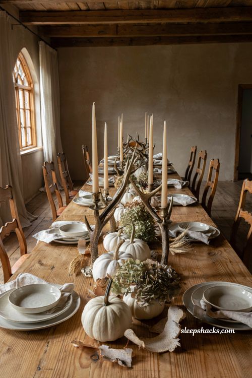 White pumpkin centerpiece with silver antler candelabras dried hydrangea and birch bark 