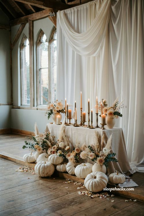 White pumpkin wedding ceremony altar with elegant autumn decor and organic seasonal styling