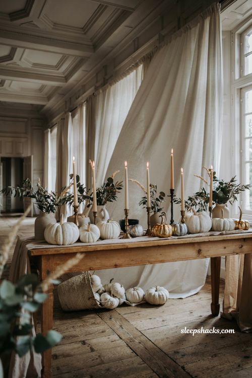 White pumpkin wedding decor with elegant gold and silver painted autumn accents