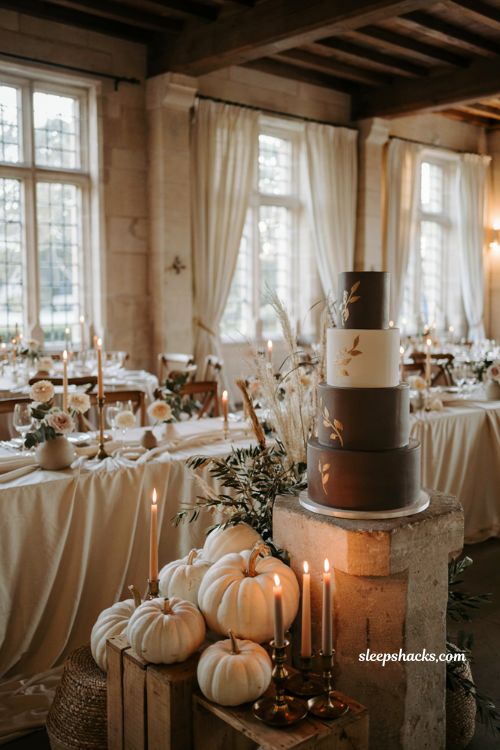 White pumpkin wedding dessert table with elegant autumn cake display and seasonal decor