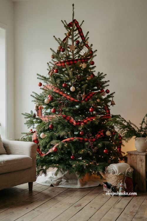Wide buffalo plaid ribbon Christmas tree with cozy farmhouse ornaments