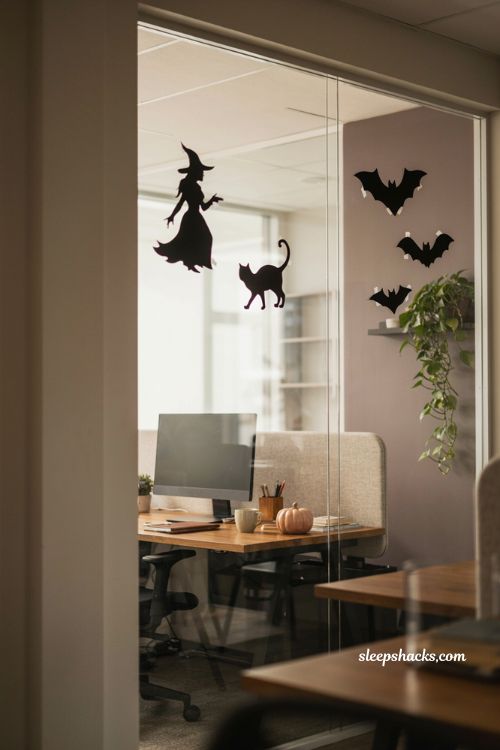 Window silhouette cutouts with bats cats and witches for office Halloween decor