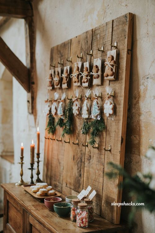 Winter wedding cookie wall with gingerbread shortbread treats rustic wood and cozy decor