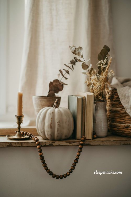 antiqued foam pumpkin with rustic farmhouse fall mantel decor ideas