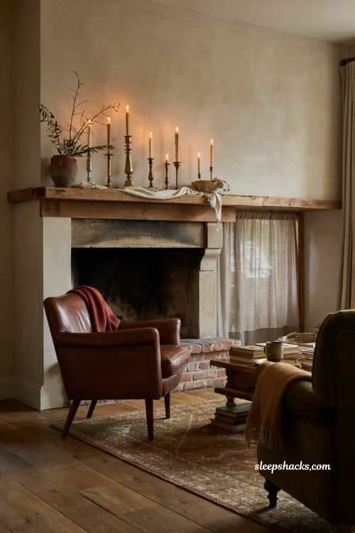 brass candlesticks on a fall mantel with rust olive and chocolate brown decor
