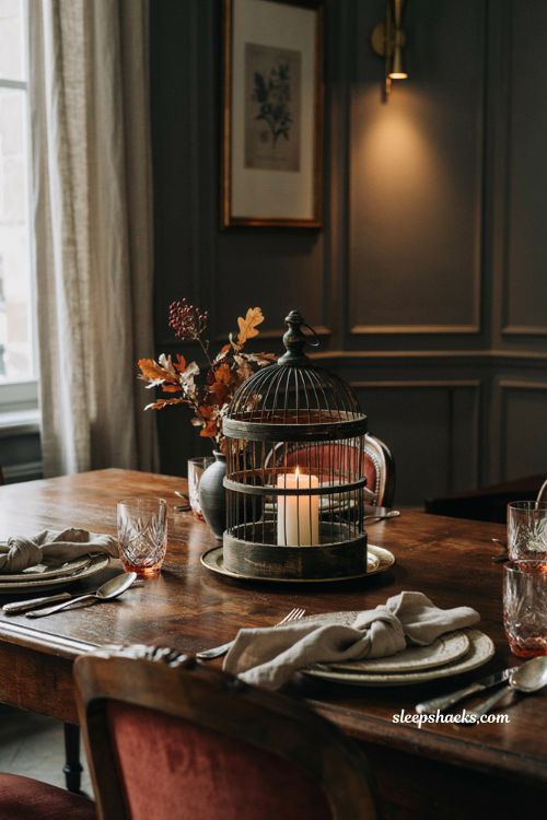 classy halloween decor with an antique birdcage candle centerpiece