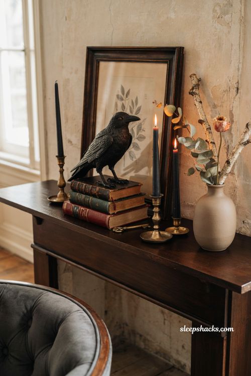 classy halloween mantel decor with an iron crow and vintage books