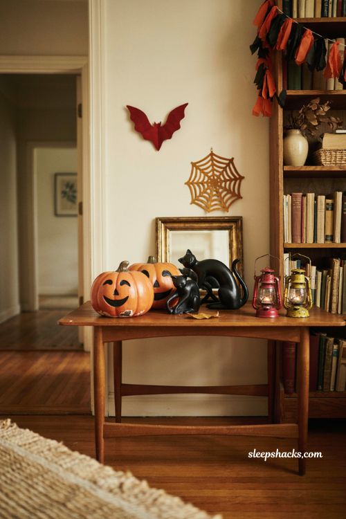 cute vintage halloween decor with jack o lanterns and black cats