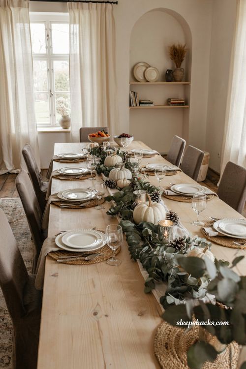 dried eucalyptus Thanksgiving table runner with white pumpkins pinecones and mercury glass