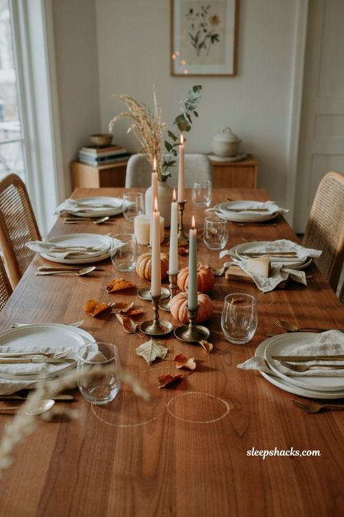fall dining table decor with candles at varying heights and cozy autumn centerpiece