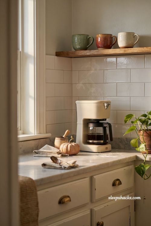 fall kitchen coffee station with stoneware canister pumpkin and seasonal mugs