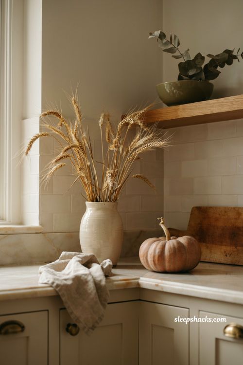 fall kitchen countertop decor with dried wheat stalks in a ceramic vase
