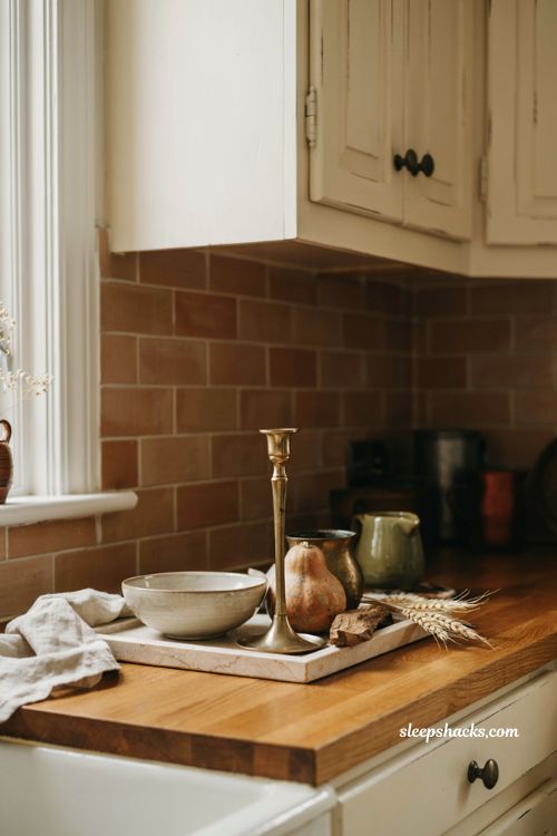 fall kitchen countertop decor with mixed brass metals gourds and wood tray