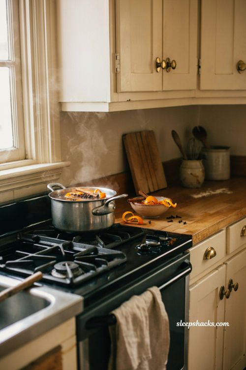 fall kitchen countertop decor with simmering orange peels cinnamon sticks and cloves