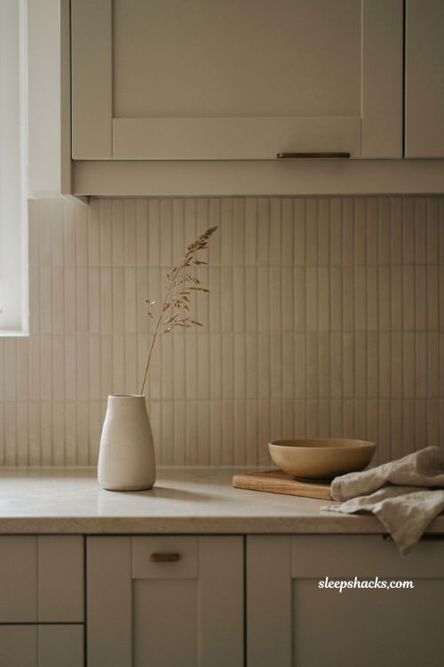 fall kitchen countertop decor with single dried stem in tall vase