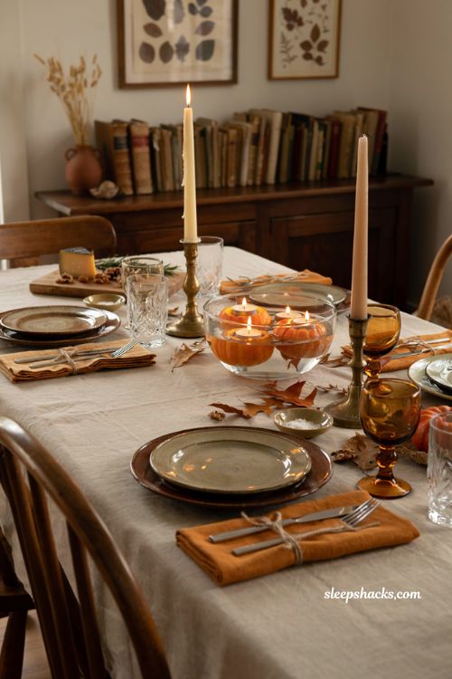 floating pumpkin candleholder centerpiece ideas for elegant autumn dinner table decor