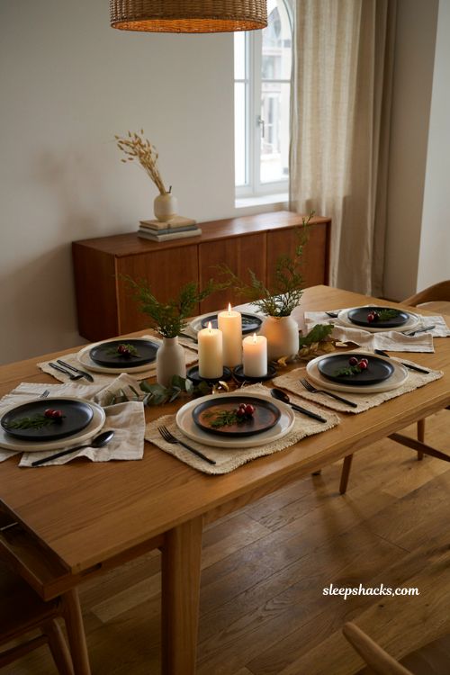 matte black plates with cream dinnerware and evergreen modern Thanksgiving table