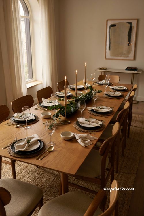modern black white and gold Thanksgiving table with green accents and gold flatware