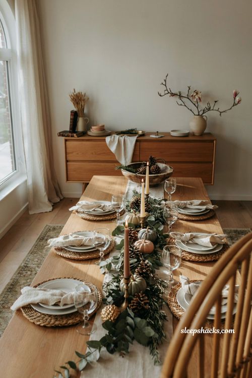 pinecone Thanksgiving centerpiece with greenery pumpkins and subtle gold accents