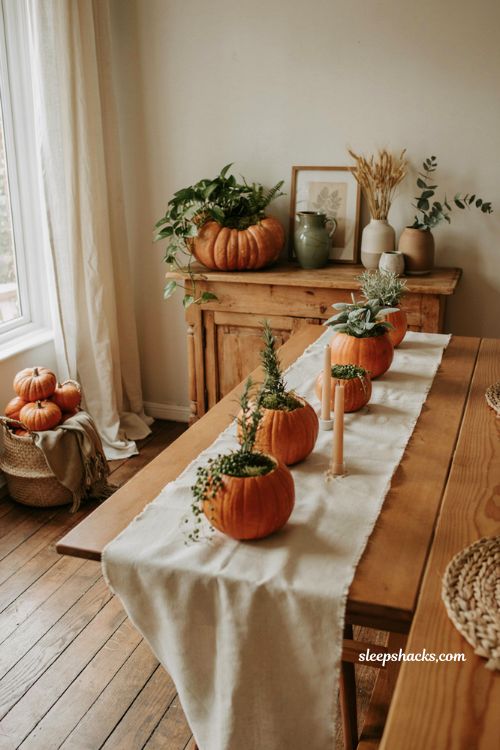 pumpkin planter centerpiece ideas with living plants and cozy autumn table decor
