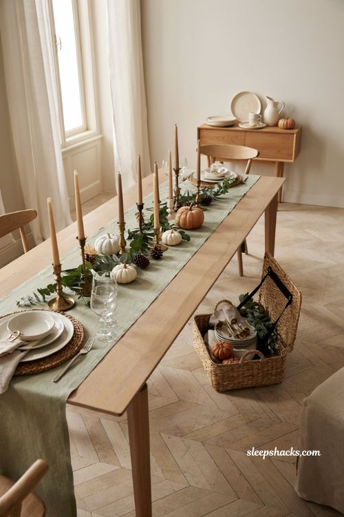 reusable Thanksgiving decor toolbox with white dinnerware candlesticks greenery and chargers