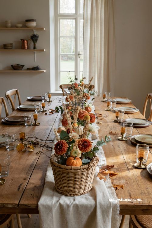rustic fall basket centerpiece with flowers and pumpkin table decor