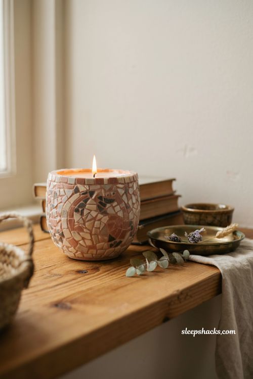 ```text Mosaic ceramic Halloween candle with handcrafted tile moon and cat motif, warm cream and charcoal ceramic vessel, ivory wax, weathered wooden shelf, antique brass dish, dried botanicals, vintage trinket bowl, worn books, natural linen, soft window light reflecting across mosaic tiles, warm candle glow, artisan boutique Halloween decor, cozy vintage cottage interior, elegant autumn atmosphere, photorealistic editorial interior photography, Pinterest-worthy ``` 