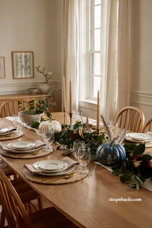 ```text chinoiserie pumpkins with eucalyptus magnolia leaves and brass Thanksgiving centerpiece ``` 