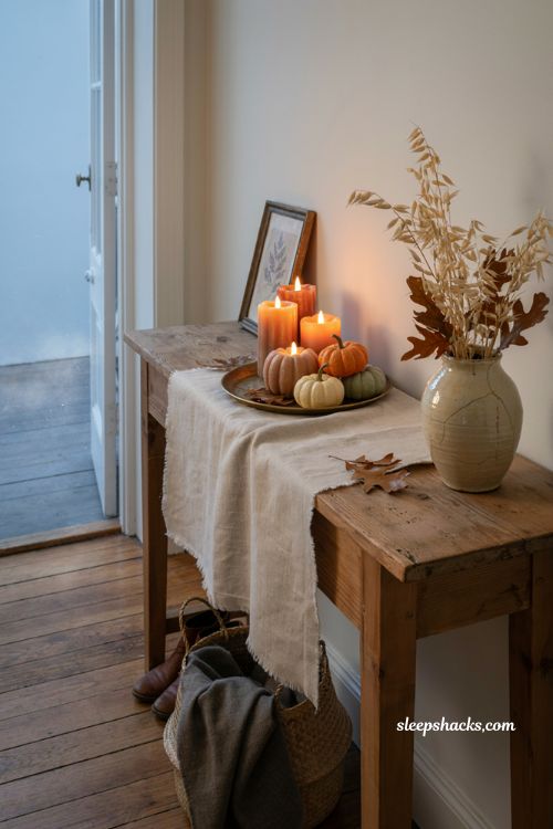 ```text id="r6k2wp" Flameless LED pumpkin candles glowing on a rustic autumn entryway console, realistic wax finish, varied pumpkin candle sizes, warm amber flicker, vintage brass tray, miniature pumpkins, dried autumn leaves, woven basket, aged ceramic vase, soft dusk light, cozy cottage Halloween decor, practical seasonal entryway styling, warm nostalgic atmosphere, photorealistic editorial interior photography, Pinterest-worthy ``` 