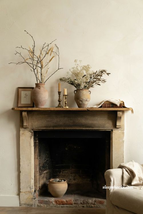 warm fall mantel decor with rustic vases branches dried grasses and brass candleholders
