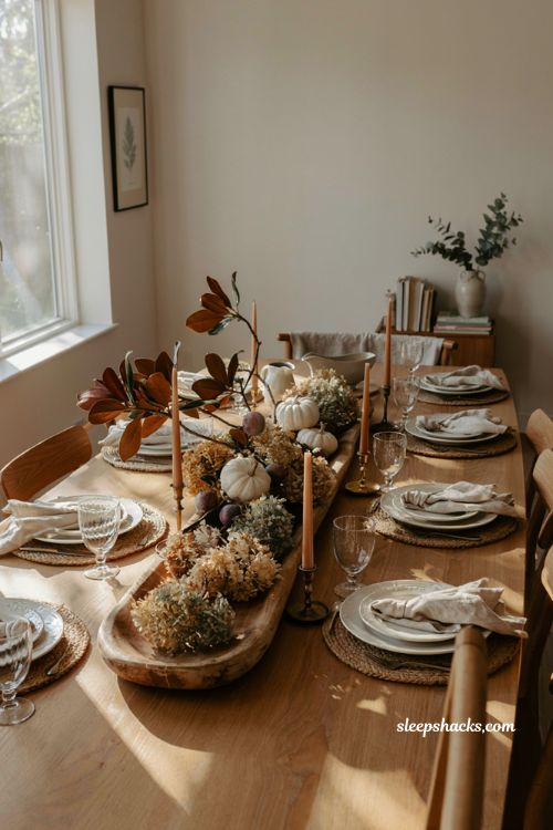 wooden dough bowl Thanksgiving centerpiece with white pumpkins dried hydrangeas and magnolia