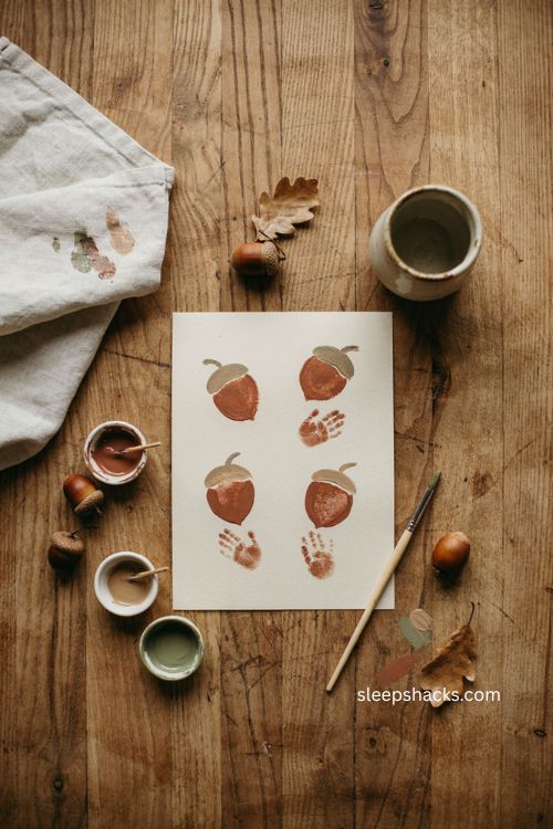 Acorn handprint art craft with brown paint for Thanksgiving 