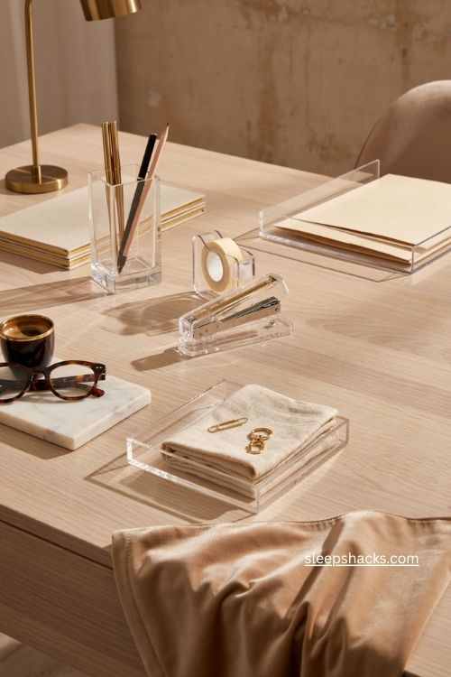 Acrylic desk accessories with gold details for a glam office 