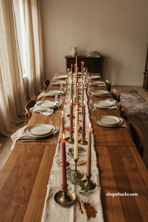 Amber candlelight Thanksgiving centerpiece with varied taper and pillar candles 
