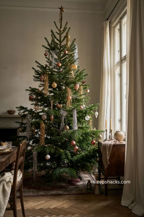 Antique lead look tinsel Christmas tree with vintage ornaments