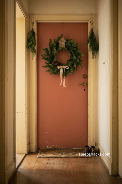 Apartment door christmas decor with cozy wreath natural greenery and simple removable holiday accents 