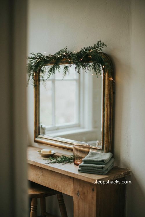 Bathroom mirror garland Christmas decor with warm white lights and greenery