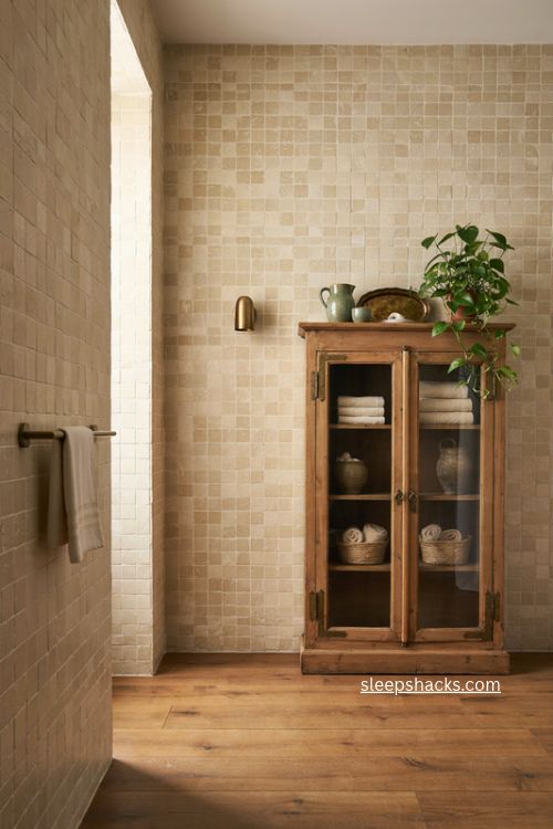 Bathroom shelves with vintage glass cabinet folded towels and antique storage
