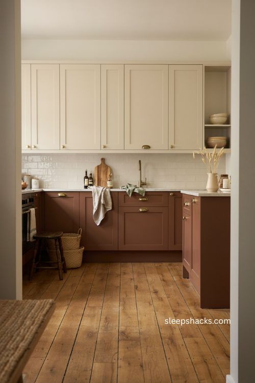 Beige upper cabinets with mocha lower cabinets and glossy white backsplash 