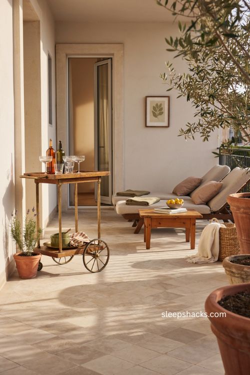 Big balcony ideas with rolling bar cart outdoor lounge seating and cozy entertaining space 