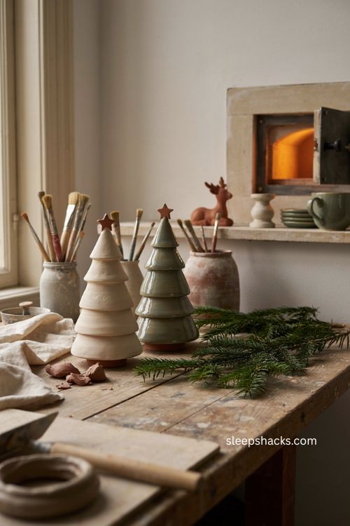 Bisque and glaze fired pottery christmas trees showing handmade ceramic finishing process